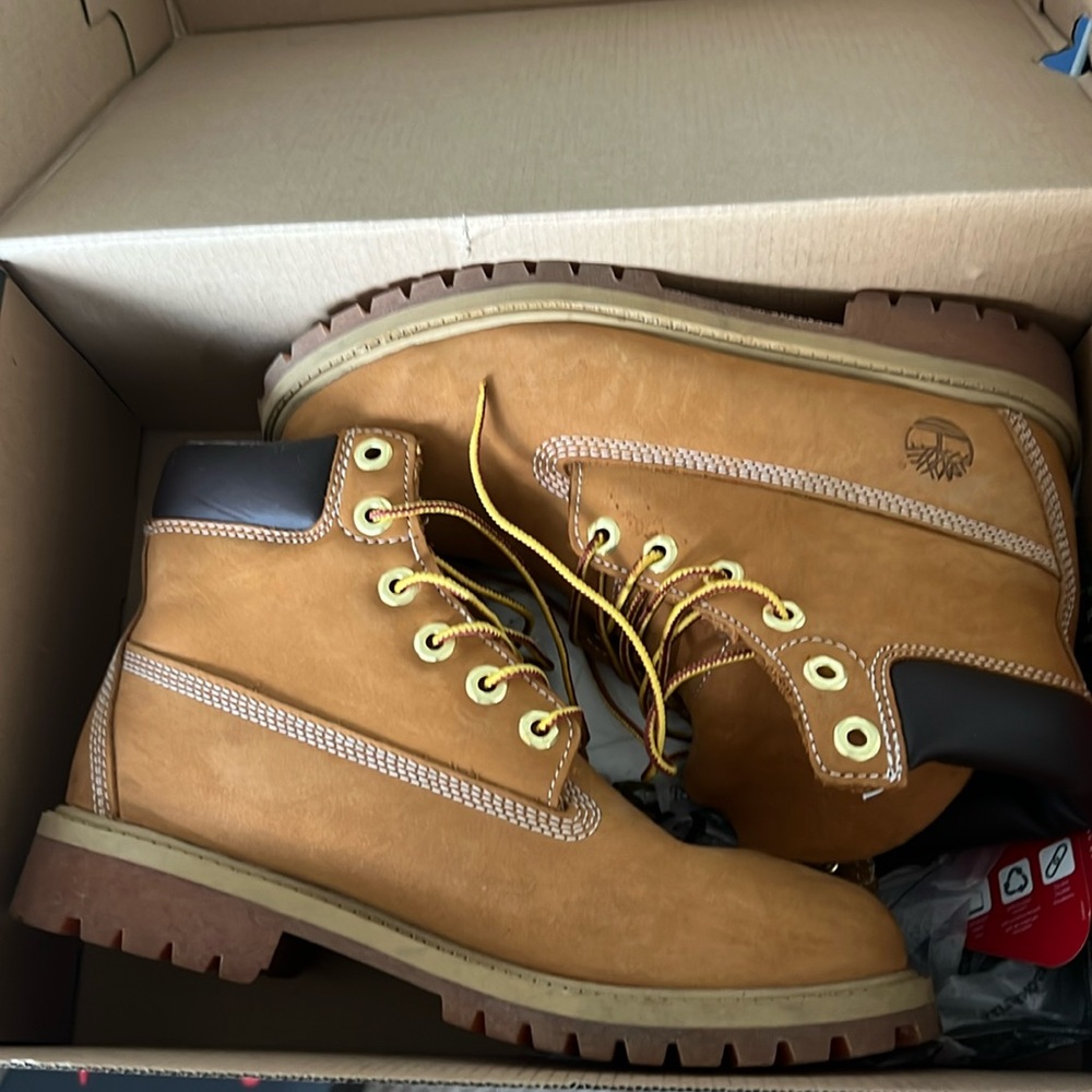 Timberland boots, run in men sizing, never worn with tags and box.